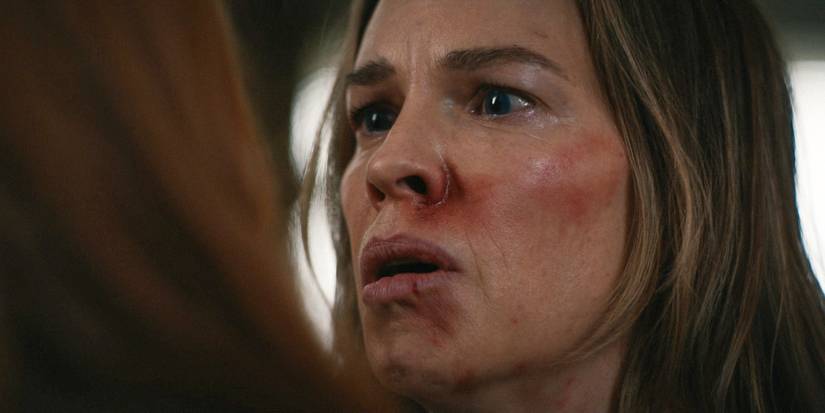 A closeup of Melissa (Hilary Swank) killing Van (Lauren Ambrose) in Yellowjackets season 3, episode 9