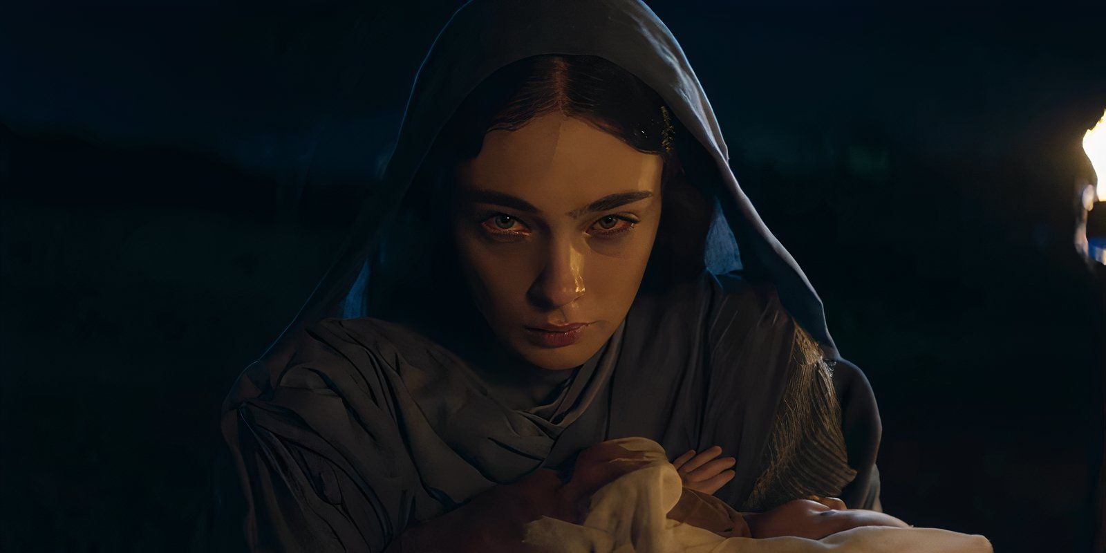 A woman holding an infant in Zero A.D.