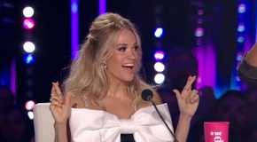 American Idol's Carrie Underwood with her fingers crossed at the judging table