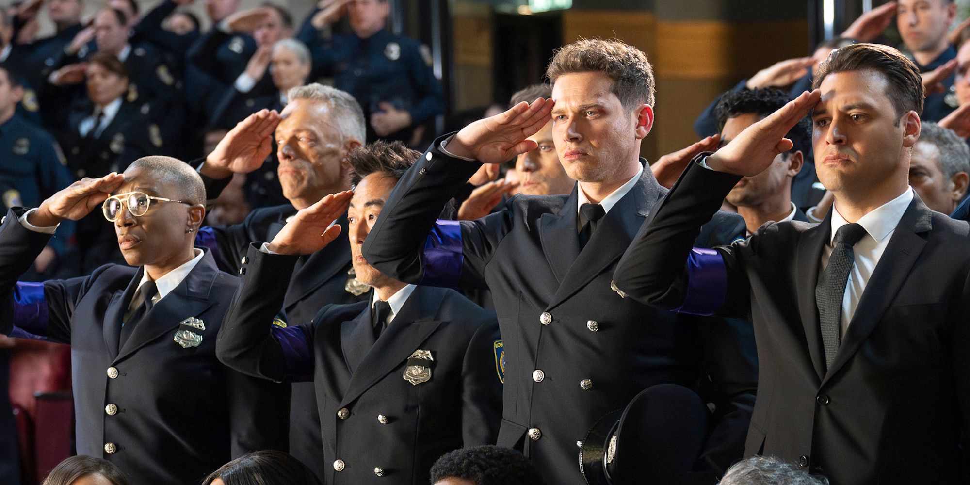 Hen (Aisha Hinds), Chimney (Kenneth Choi), Buck (Oliver Stark), and Eddie (Ryan Guzman) saluting at Bobby's funeral in 9-1-1 season 8, episode 16.