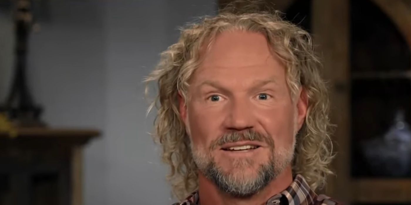 A close up of Sister Wives' Kody Brown smiling in a confessional