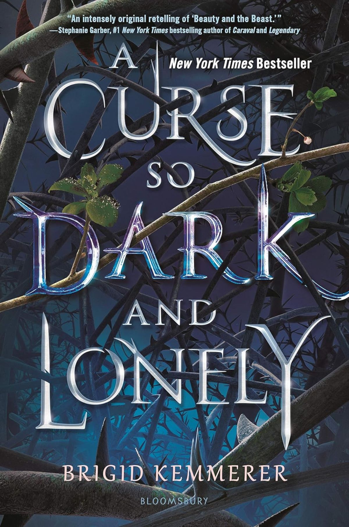 A Curse So Dark And Lonely Cover featuring the title in silver, tree branches, and a blue background