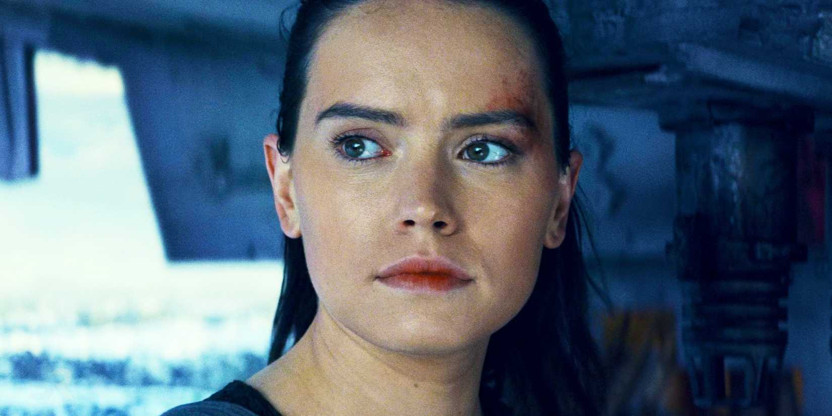 Rey standing at the ramp of the Millennium Falcon in Star Wars: The Last Jedi.