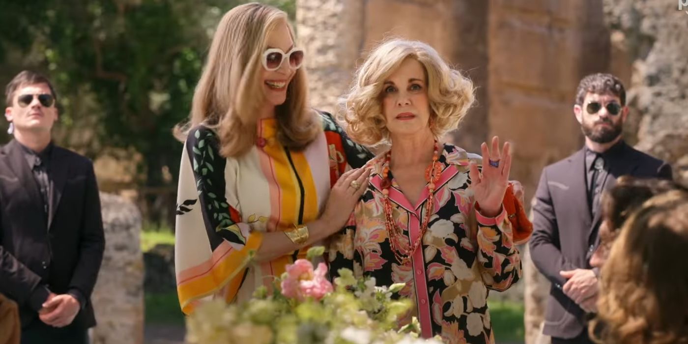 Allison Janney as Linda holding onto Elizabeth Perkins as Margaret while she waves in Another Simple Favor