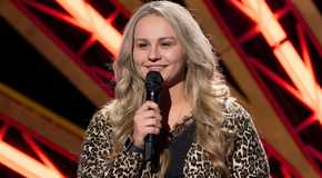 American Idol Breanna Nix smiling while holding the mic to her mouth close up