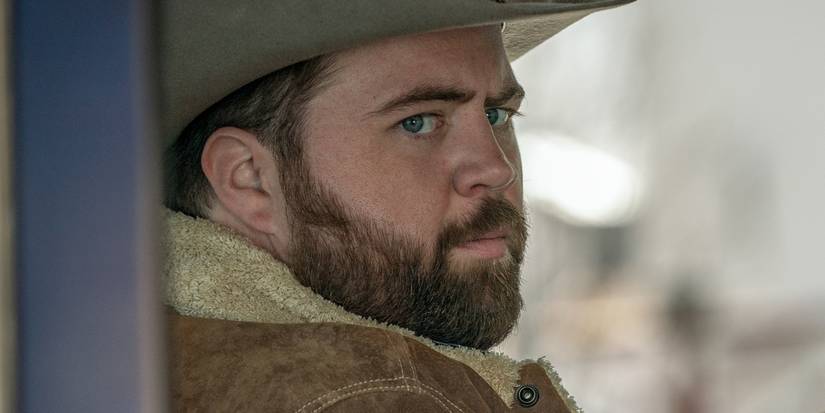 Paul Walter Hauser looking suspicious in Americana Exclusive Still Featured ScreenRant 