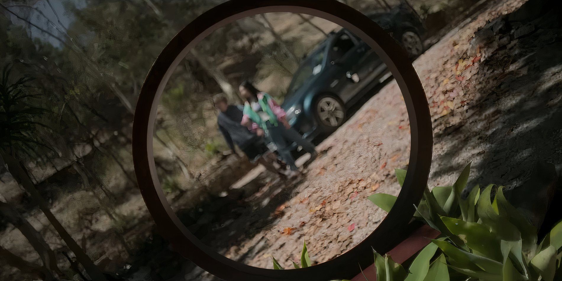 Andy and Piper shown through a metal hoop in Bring Her Back
