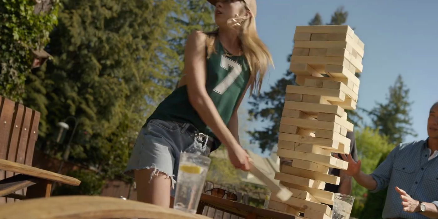 Anna Lore as Julia Campbell turning around while playing Jenna at the barbecue in Final Destination Bloodlines