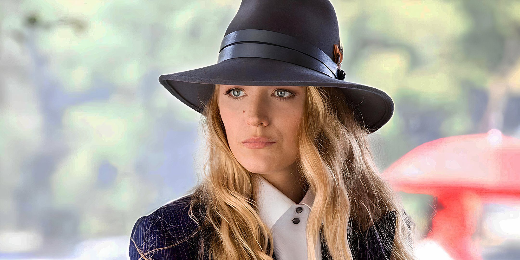 Blake Lively looking serious while wearing a black outfit in A Simple Favor.