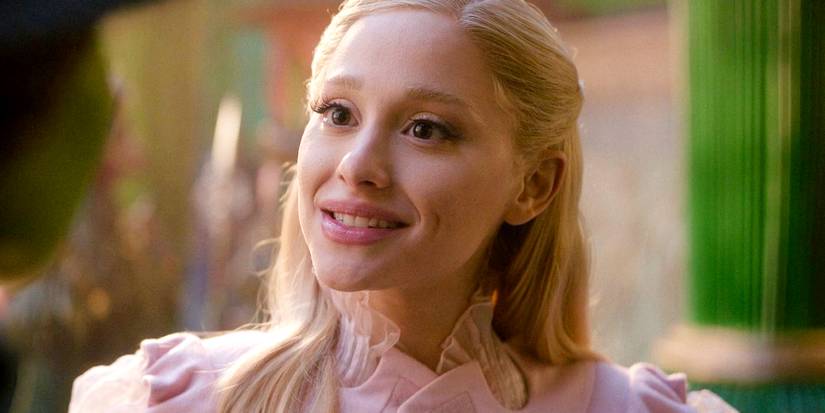 Ariana Grande as Glinda smiling at Elphaba in Wicked