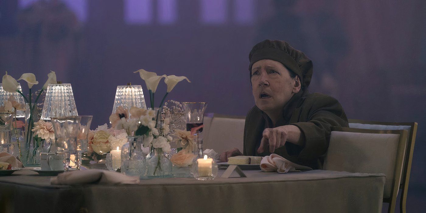 Aunt Lydia with a piece of cake at Serena Joy's wedding in The Handmaid's Tale season 6, episode 8