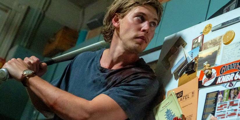 Austin Butler as Hank holding a baseball bat and looking scared in Caught Stealing