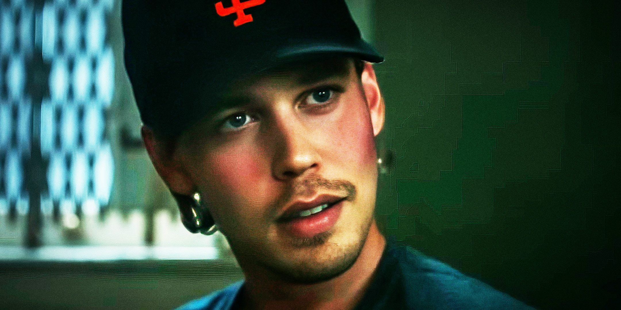 Austin Butler wearing a baseball hat in a close-up in Caught Stealing