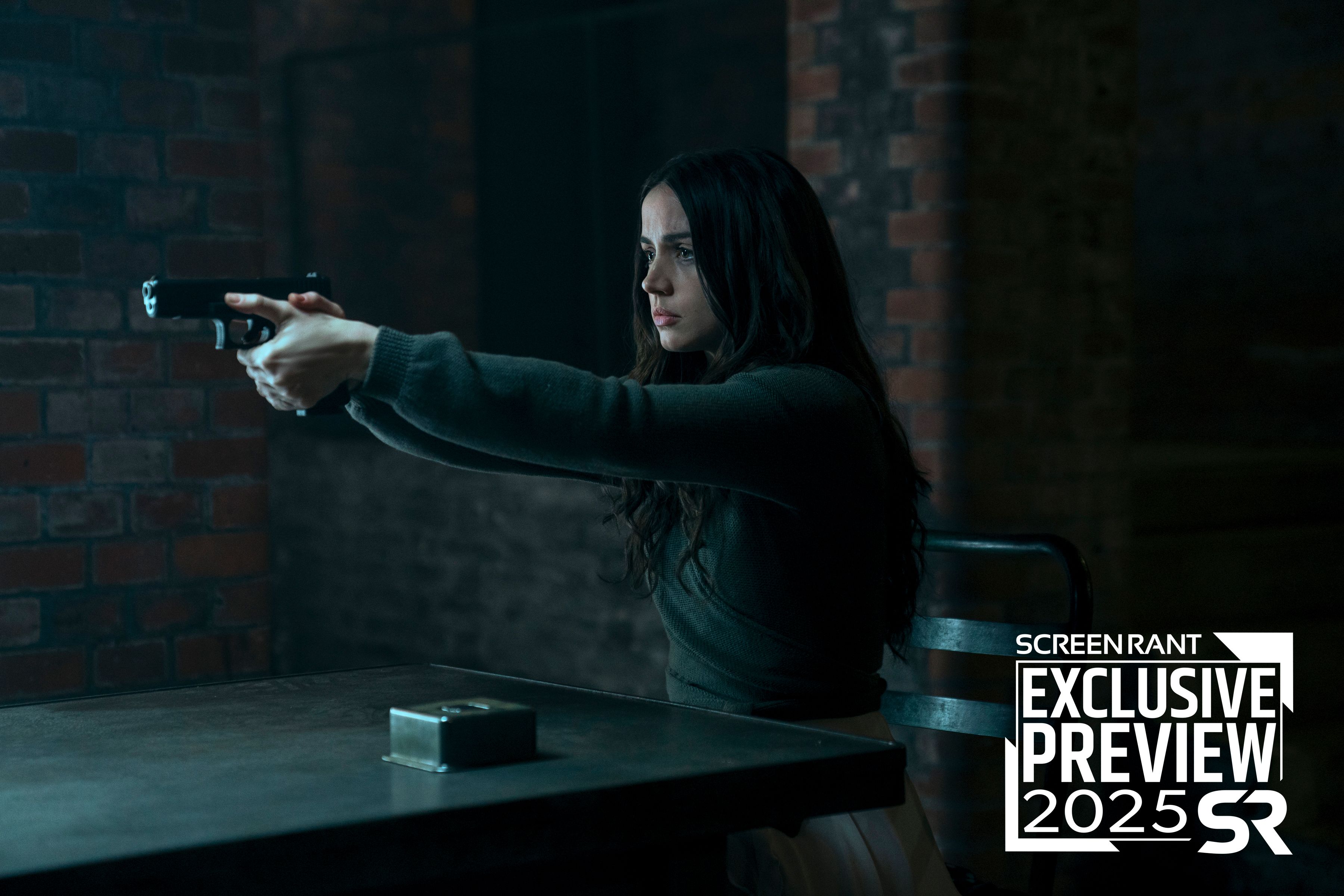Ana de Armas as Eve points a gun in Ballerina