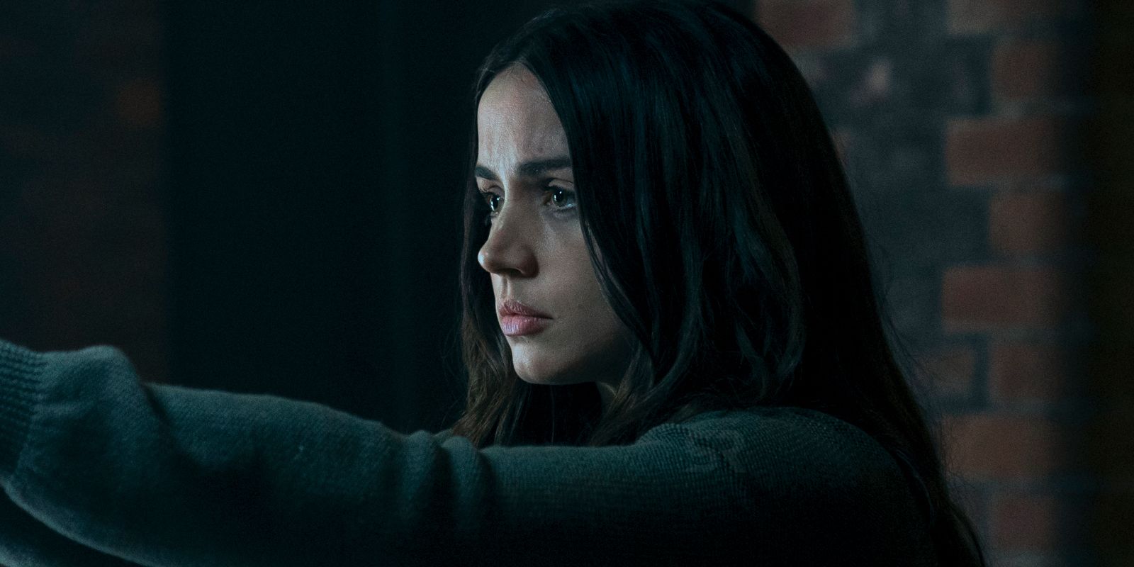 Ballerina Exclusive Still Featured ScreenRant Ana de Armas pointing gun