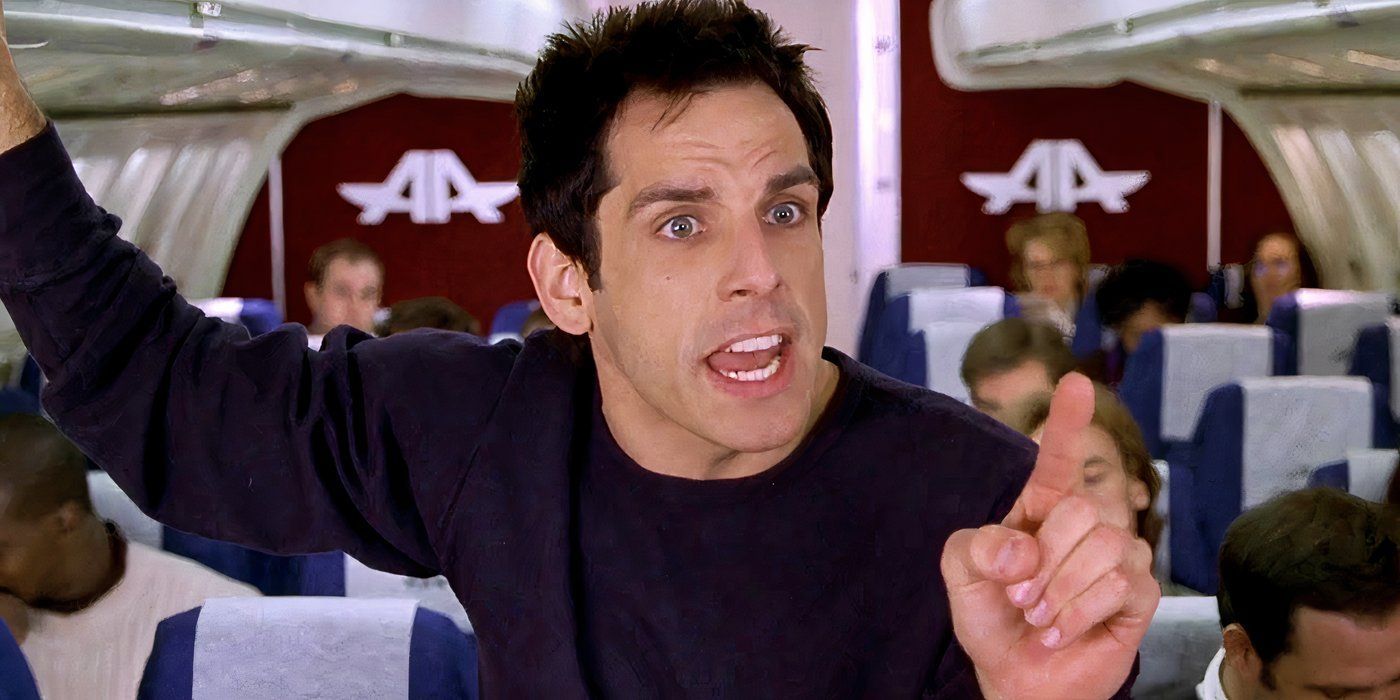 Ben Stiller pointing his finger while standing on an airplane in Meet the Parents