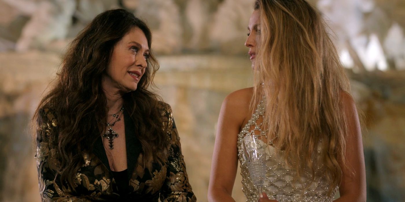 Blake Lively as Emily sitting by a fountain with Elena Sofia Ricci as Portia Versano in Another Simple Favor