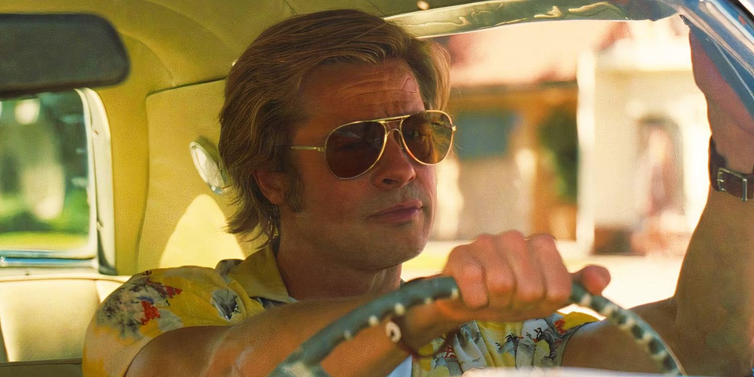 Brad Pitt as Cliff Booth, wearing sunglᴀsses and driving a car in Once Upon a Time in Hollywood
