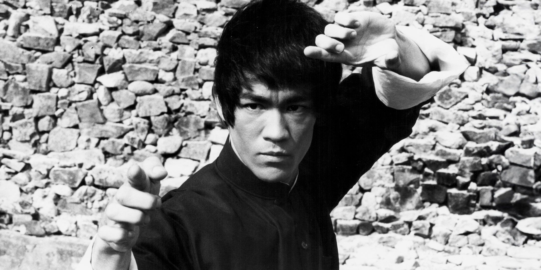 Bruce Lee strikes a martial arts pose