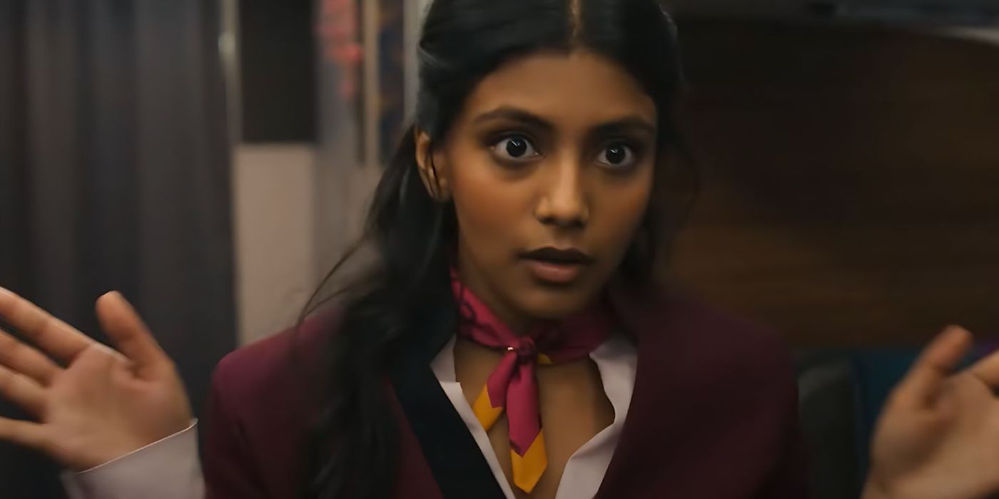 Charithra Chandran as Isha holding up her hands with wide eyes in Fight or Flight