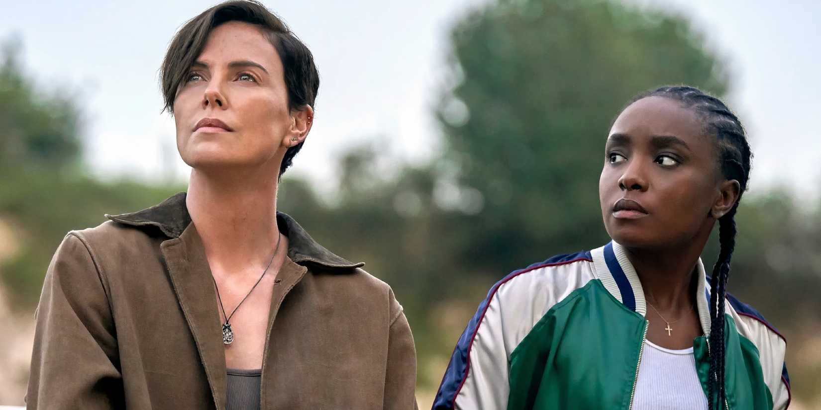 KiKi Layne as Nile looks over at Charlize Theron as Andy in The Old Guard