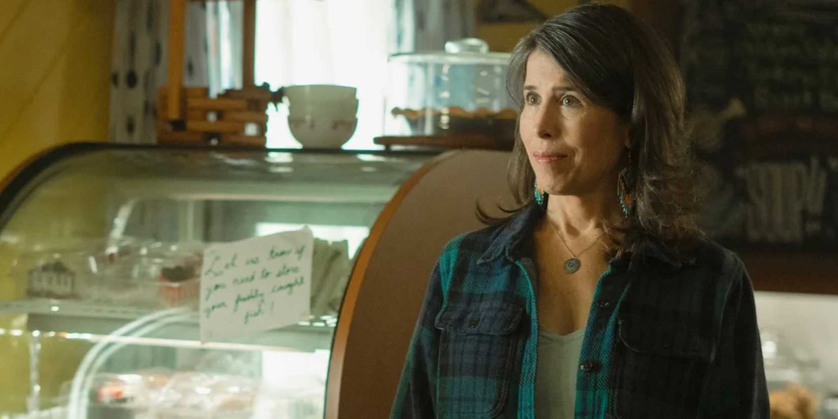 Edna in front of the cold case at the campground in Sullivan's Crossing