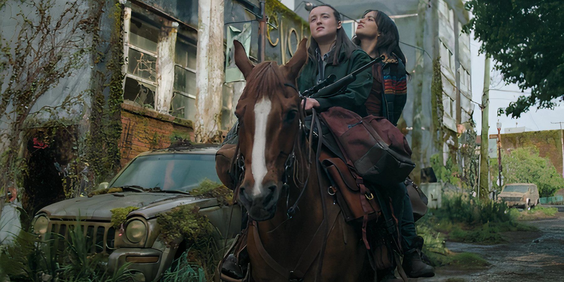 Ellie (Bella Ramsey) and Dina (Isabela Merced) riding Shimmer in The Last of Us season 2