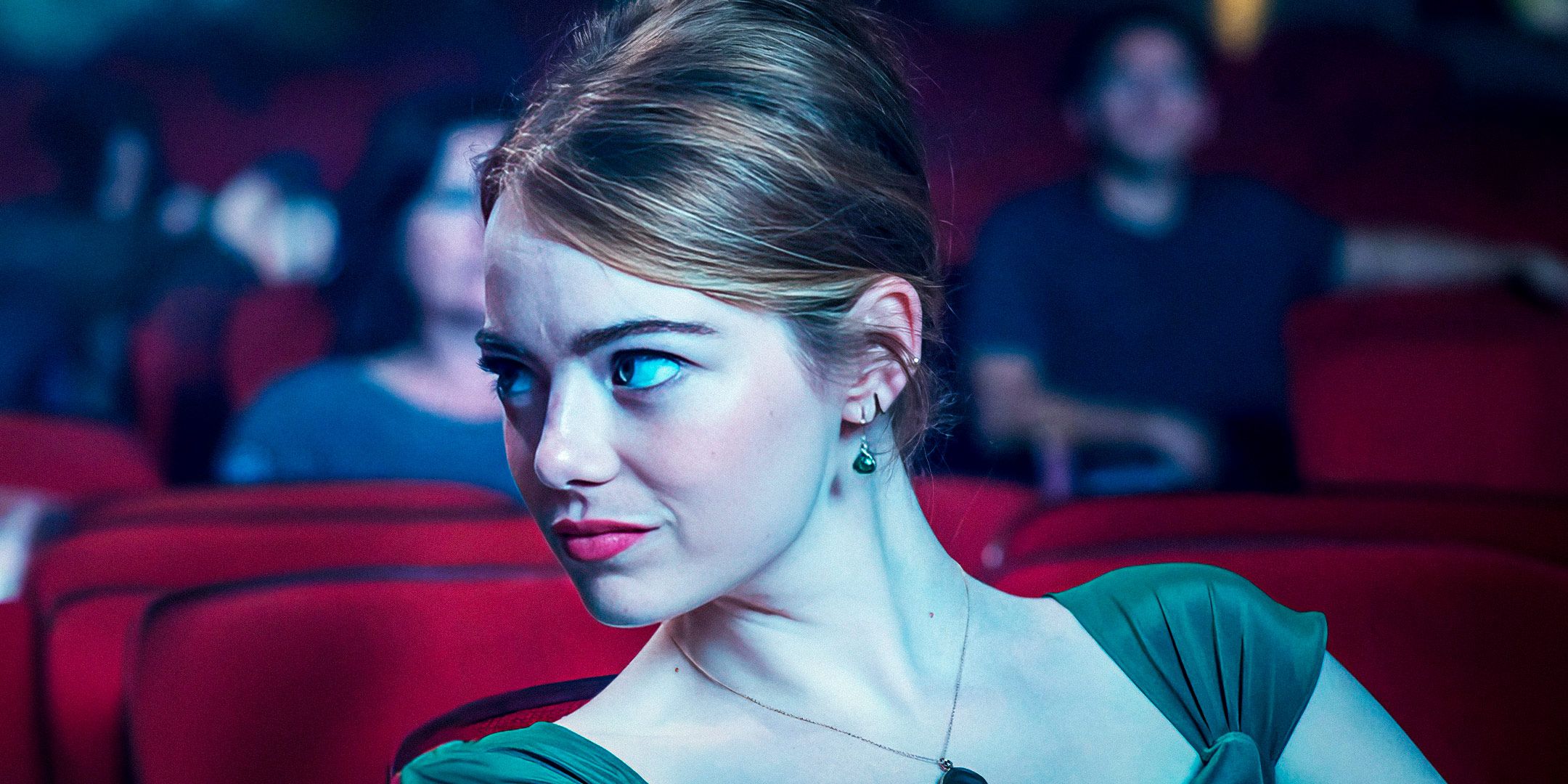 Emma Stone as Amelia "Mia" Dolan in a movie theater in La La Land.
