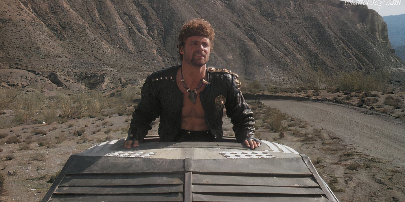 A man rides on top of an armored car in Exterminators of the Year 3000