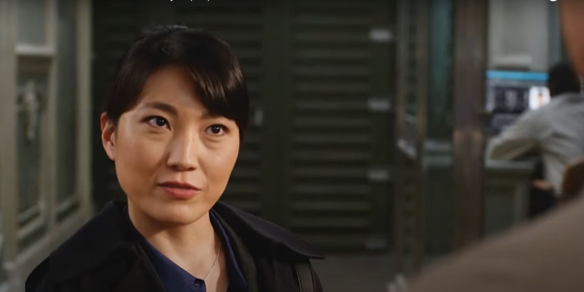 FBI International Japanese Agent standing in a room