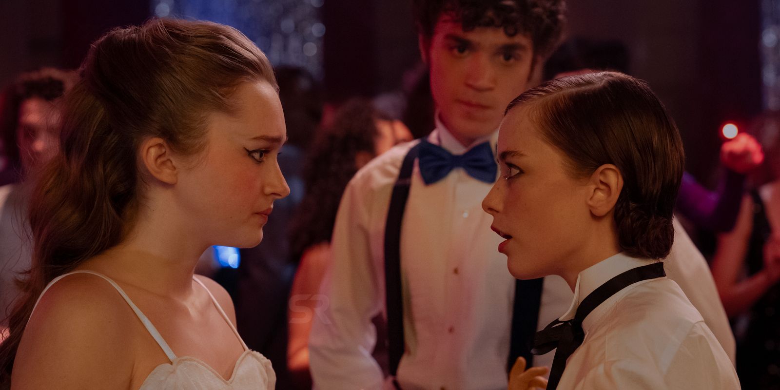 Three students looking worried at the dance in Fear Street: Prom Queen