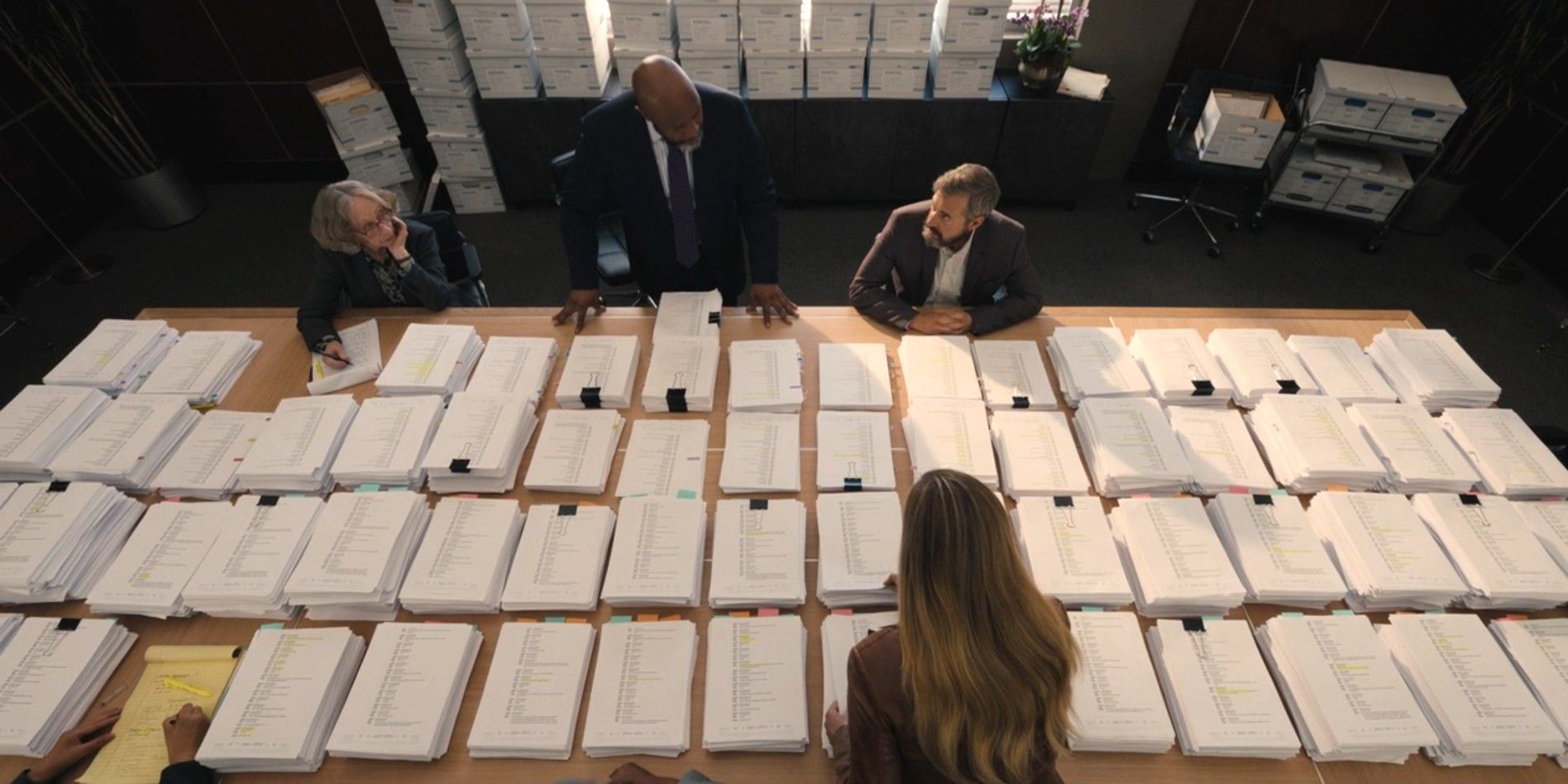 A group of lawyers and Michael and Kristine Barnett standing around a huge display of printed Facebook Messenger texts in Good American Family episode 8