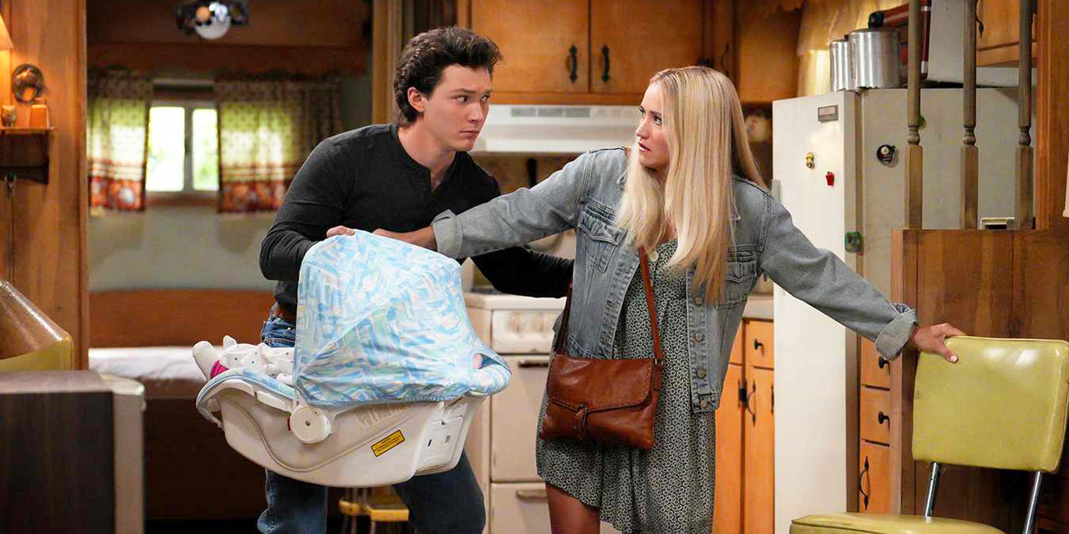 Mandy glaring at Georgie while he carries the baby in a carseat in Georgie and Mandy's First Marriage