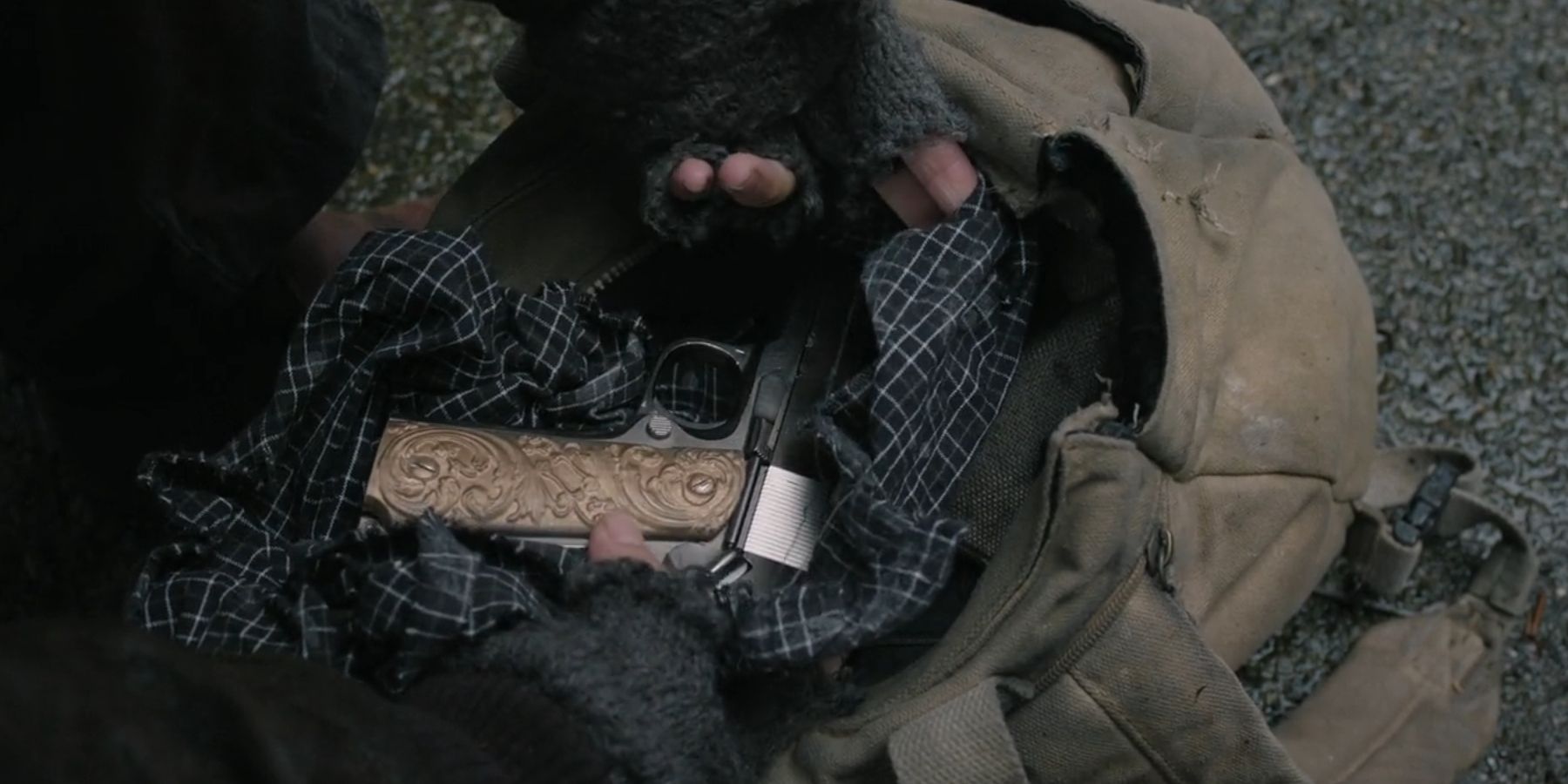 Ginny pulling a gun out of her bag in The Walking Dead: Dead City season 2