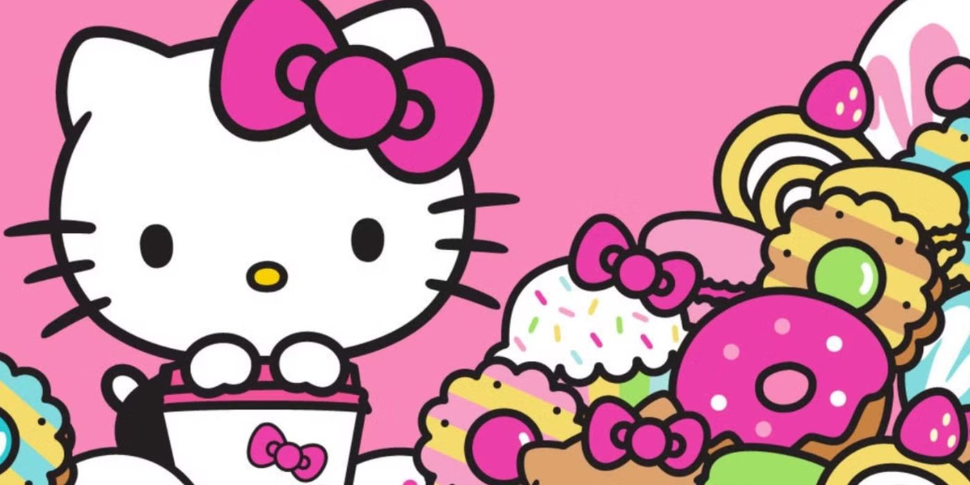 Hello Kitty holds a bucket next to a mountain of candy and pastries