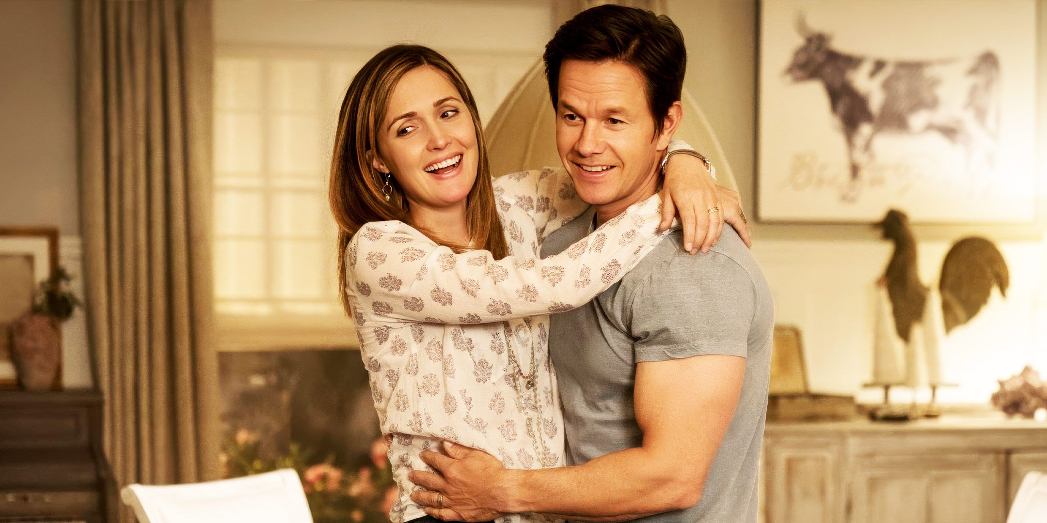 Mark Wahlberg and Rose Byrne hugging in Instant Family
