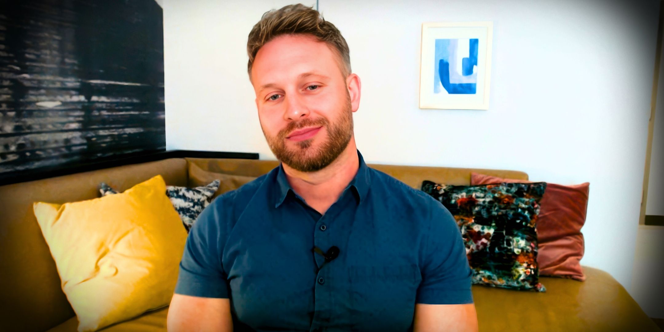 90 Day Fiancé’s Matt Branis with a couch behind him.