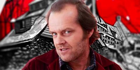 Jack Nicholson as Jack Torrance looking intensely at the camera in front of The Shining poster