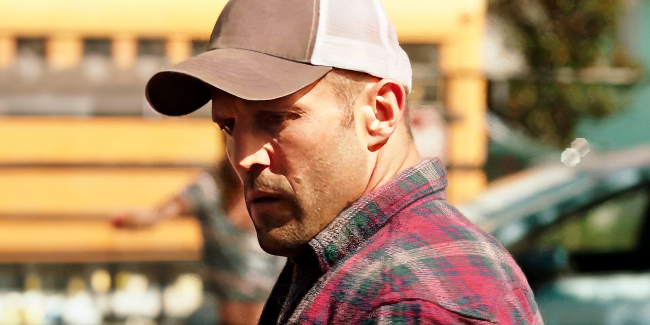 Jason Statham looks down with alarm in a scene from Homefront
