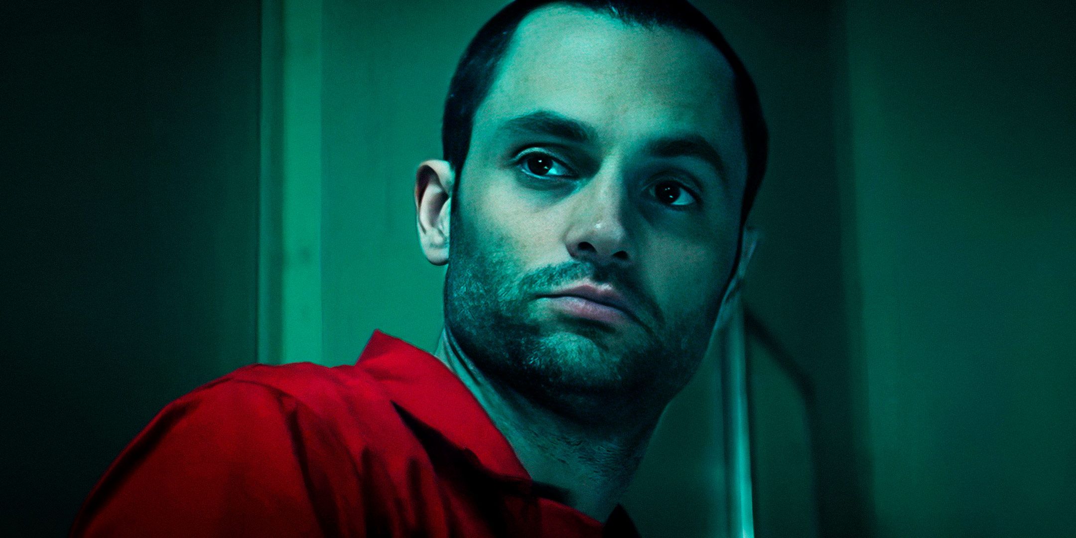 Penn Badgley as Joe Goldberg wearing an orange prison jumpsuit in You season 5