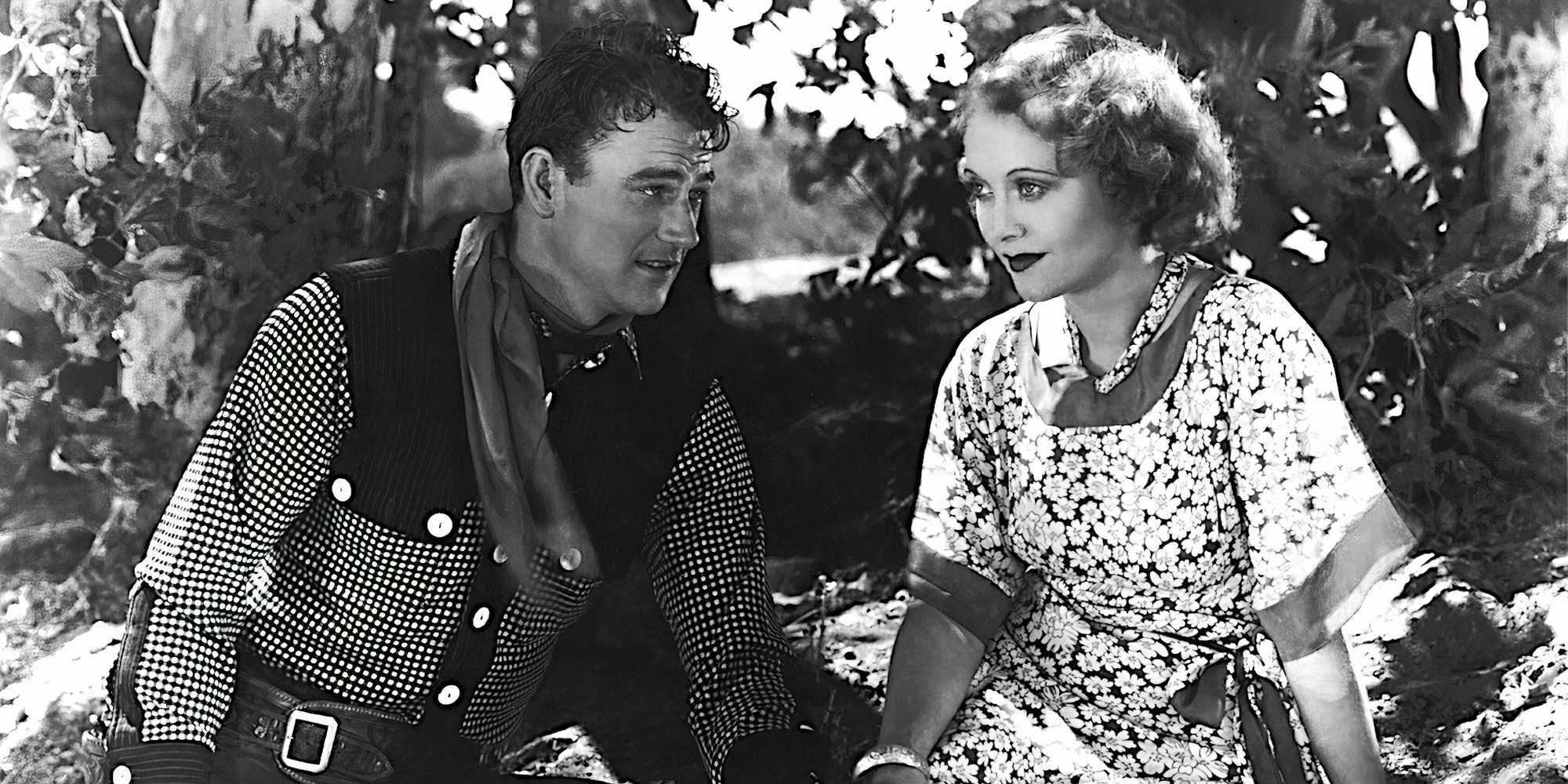 John Wayne and Shelia Terry share a tender moment in Neath the Arizona Skies