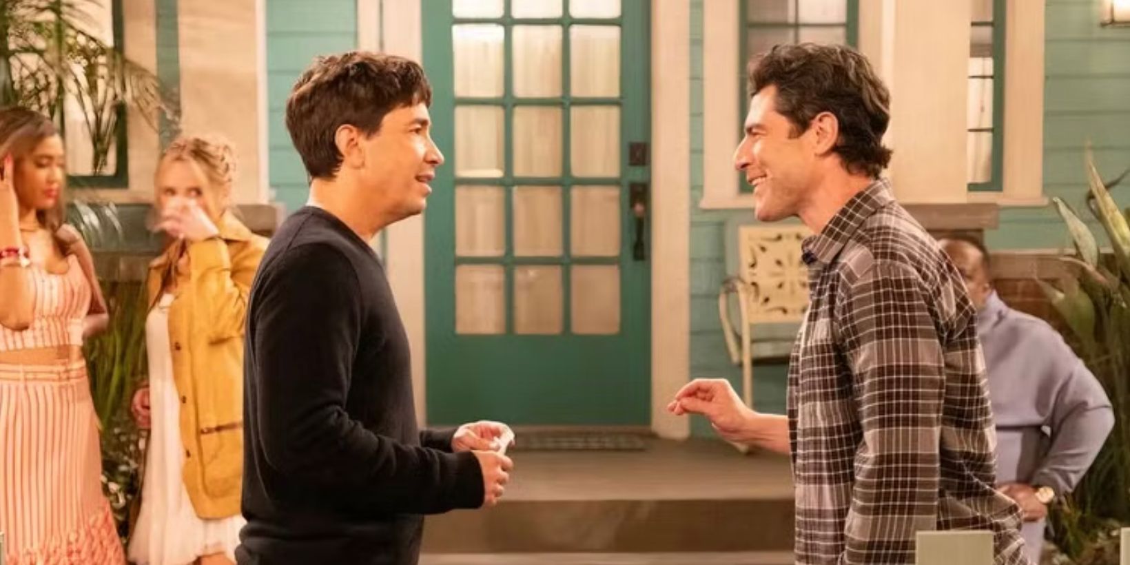 Justin Long and Max Greenfield talking in The Neighborhood season 7 finale
