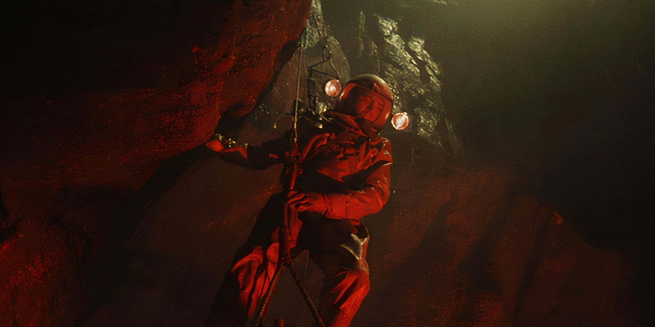 Kieron Moore lowers down into a fiery cave. 