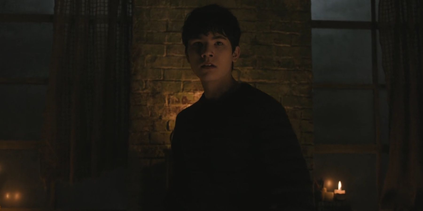 Logan Kim as Hershel standing in a dimly lit room in The Walking Dead: Dead City season 2