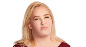 Mama June Shannon in Mama June- Family Crisis in maroon off-shoulder dress looking mean