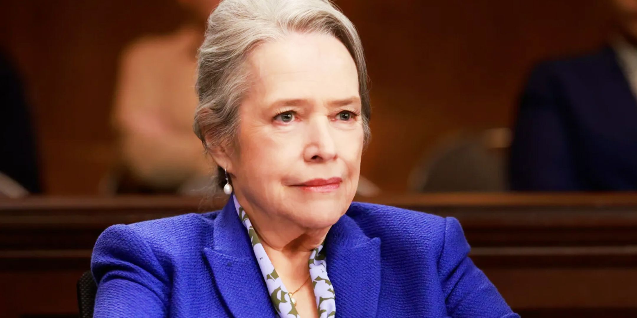 Kathy Bates as Matty Matlock in a courtroom with a nervous smile in Matlock