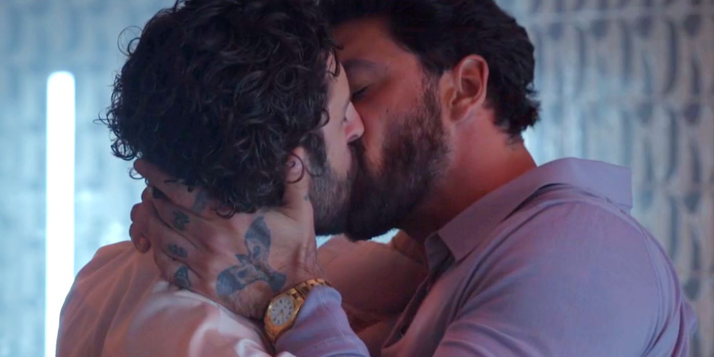 Michele Morrone as Dante Versano kissing Lorenzo de Moor as Matteo Bartolo in Another Simple Favor