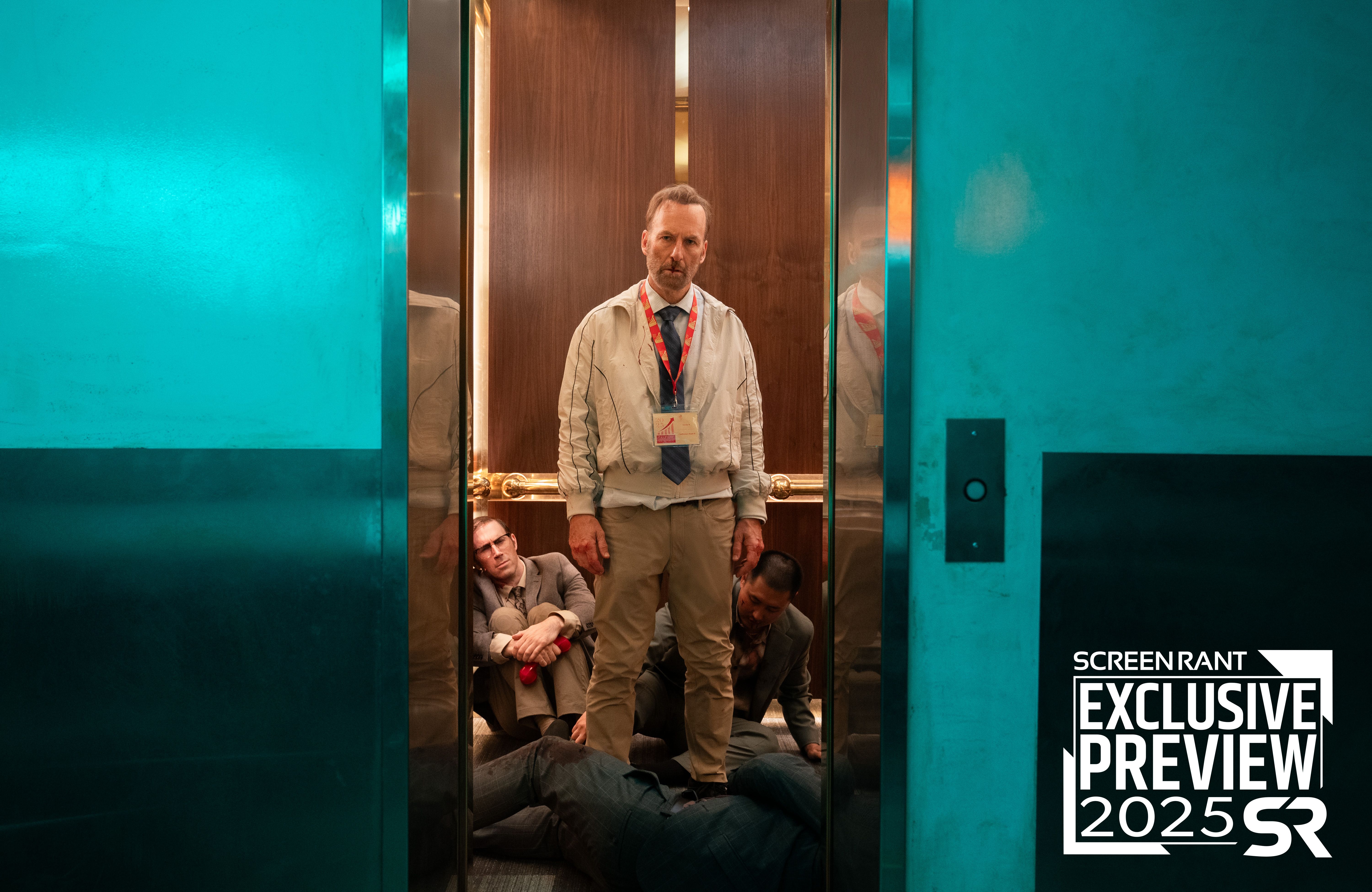 Bob Odenkirk as Hutch in an elevator surrounded by people on the floor in Nobody 2