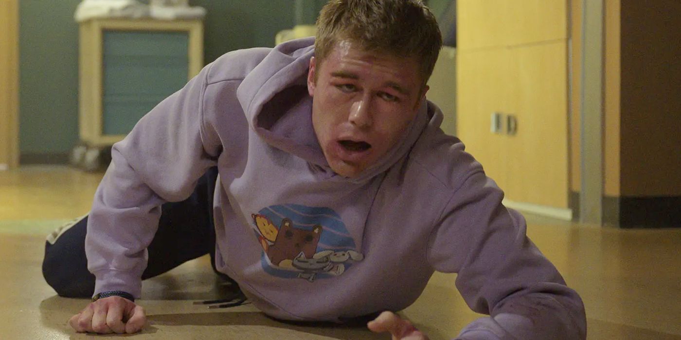 Owen Patrick Joyner as Bobby Campbell on the hospital floor with his face swelling in Final Destination Bloodlines