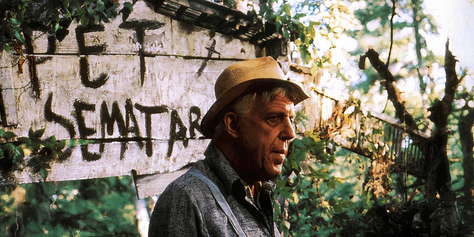 Judd Crandall looks disturbed in front of the sign in Pet Sematary 